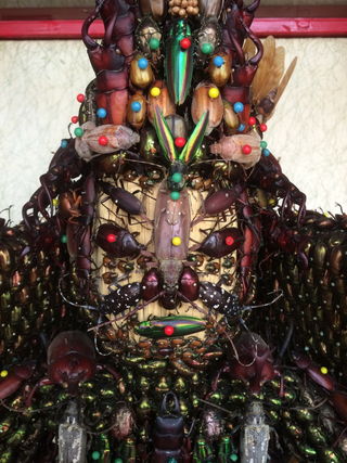 Illustration for article titled Japanese Statues Made with Dead Bugs